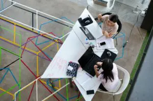 woman sitting at a Reno networking event discussing opportunities 